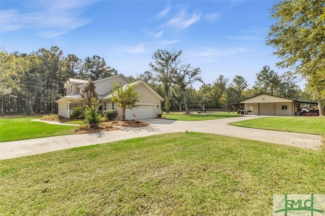 5261 Mill Branch Club Rd, Pembroke, GA 31321 - view of property exterior featuring driveway, a yard, and a garage