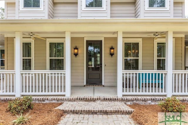 entrance to property with covered porch and ceiling fan