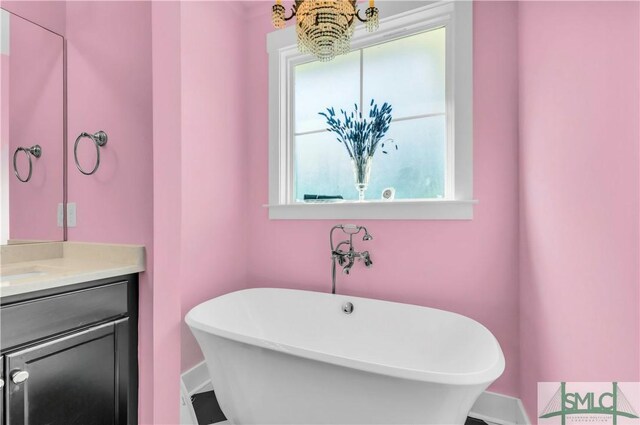 5261 Mill Branch Club Rd, Pembroke, GA 31321 - full bathroom featuring a freestanding tub, vanity, and plenty of natural light