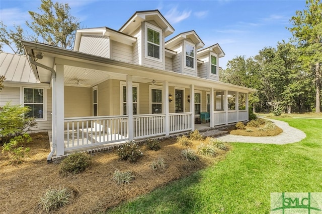 view of front of home with a front lawn and covered porch