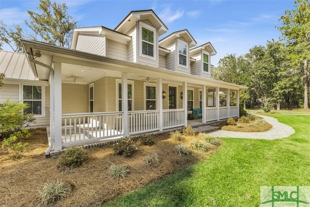 5261 Mill Branch Club Rd, Pembroke, GA 31321 - view of front of house with covered porch, ceiling fan, and a front lawn