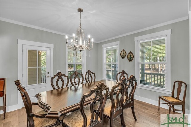 5261 Mill Branch Club Rd, Pembroke, GA 31321 - dining space featuring a chandelier, ornamental molding, light wood-style floors, and baseboards