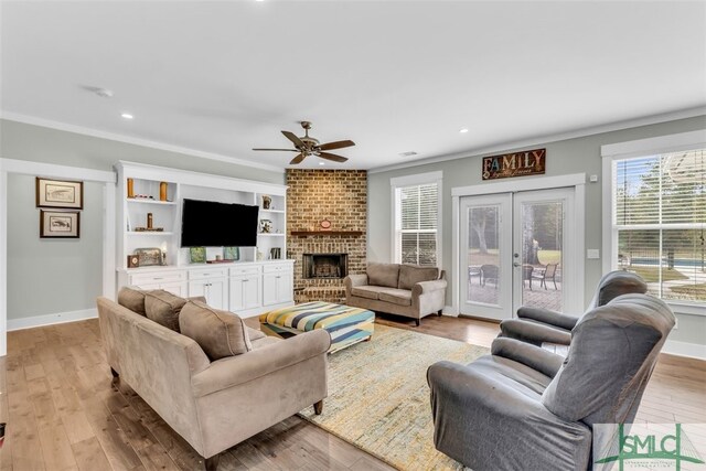 5261 Mill Branch Club Rd, Pembroke, GA 31321 - living area featuring ceiling fan, ornamental molding, recessed lighting, a fireplace, and french doors