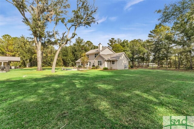 5261 Mill Branch Club Rd, Pembroke, GA 31321 - view of green lawn featuring view of wooded area