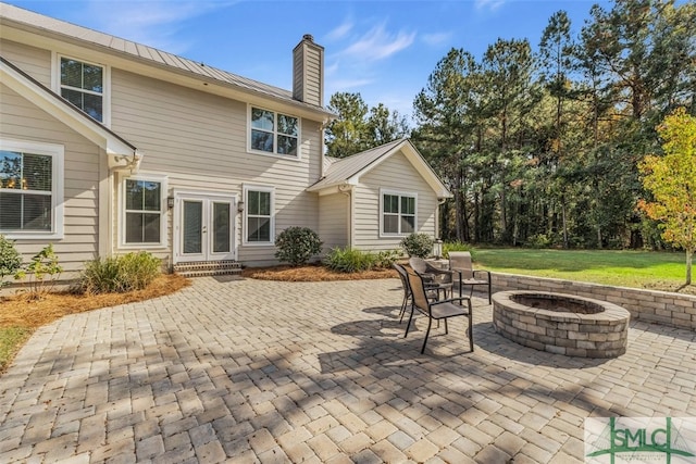 view of patio / terrace with a fire pit