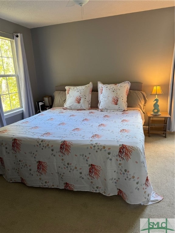 unfurnished bedroom featuring carpet and ceiling fan