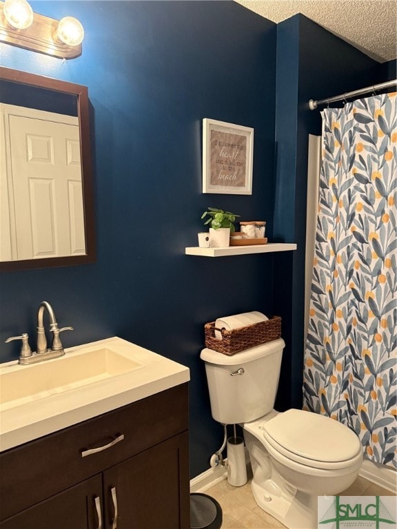 bathroom with toilet, a textured ceiling, vanity, and tile patterned floors