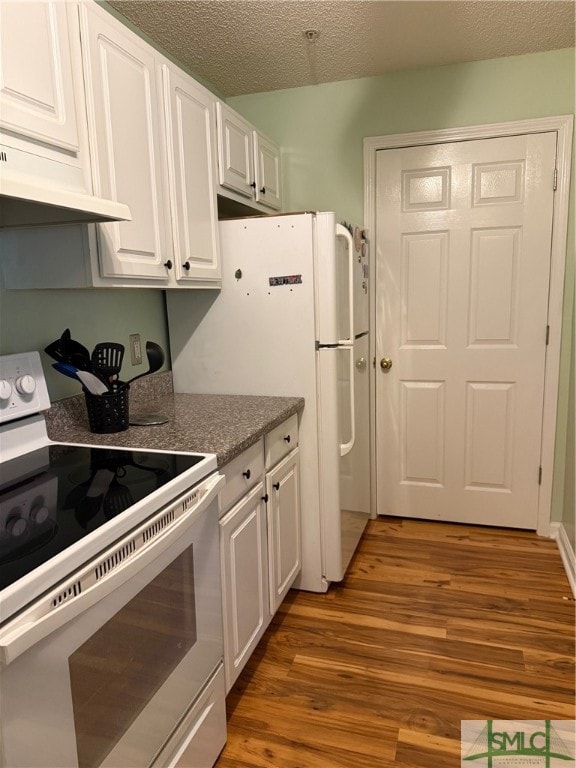 kitchen with a textured ceiling, white cabinets, dark hardwood / wood-style floors, and white electric stove