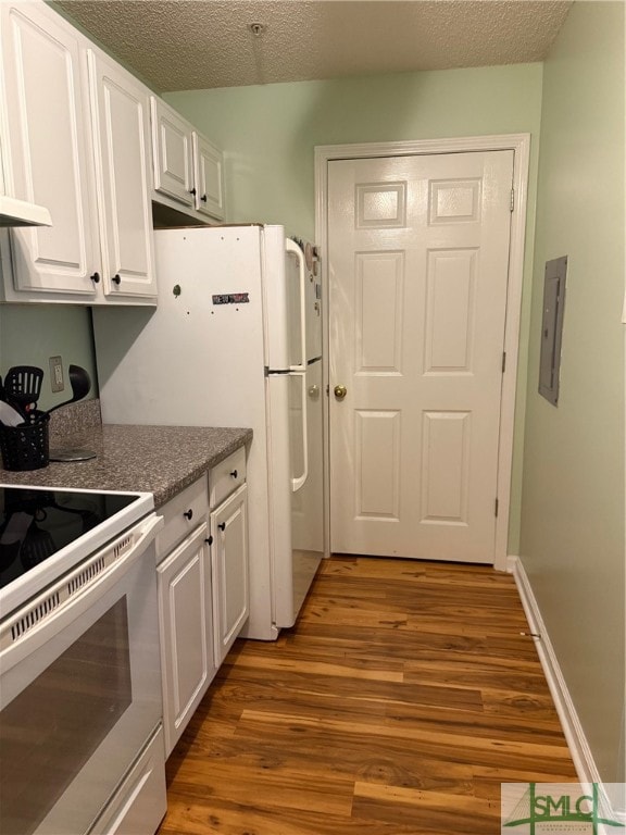 kitchen featuring a textured ceiling, white range with electric cooktop, white cabinets, dark wood-type flooring, and electric panel