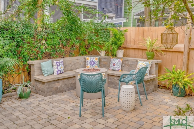 view of patio featuring a fire pit