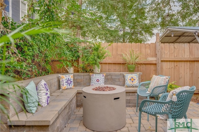 view of patio featuring a fire pit