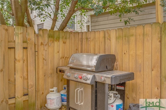 view of patio featuring a grill