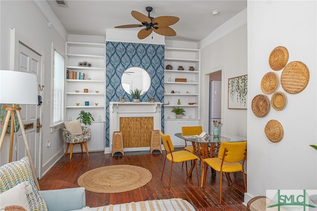 living room featuring a fireplace, dark hardwood / wood-style flooring, and ceiling fan