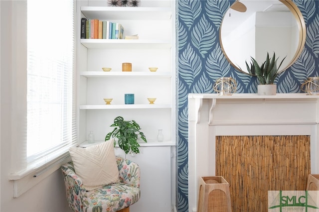 sitting room featuring built in shelves