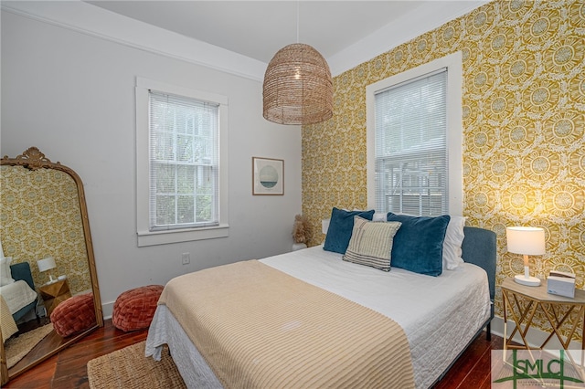 bedroom with dark wood-type flooring