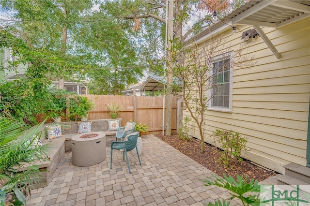 view of patio with a fire pit