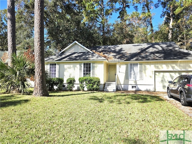 ranch-style home with a garage and a front lawn