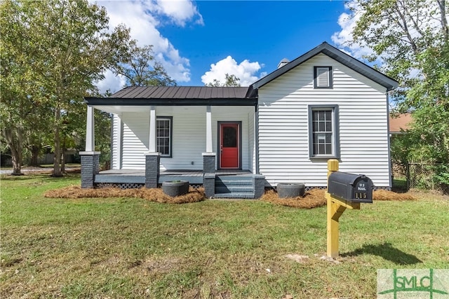 view of front of home with a porch and a front lawn