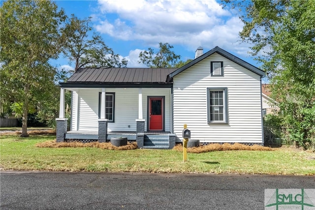 view of front of property with a front yard and a porch