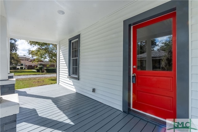 view of exterior entry featuring a porch