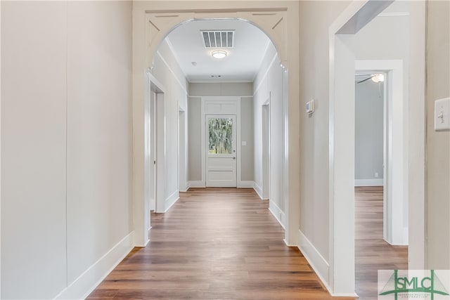 hall with hardwood / wood-style flooring