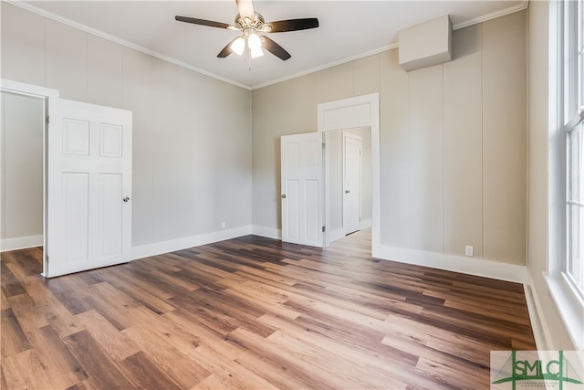 unfurnished room featuring ornamental molding, hardwood / wood-style floors, and ceiling fan