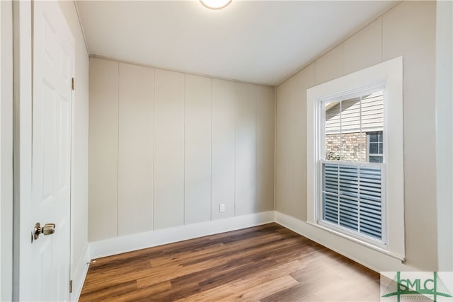 empty room with wood-type flooring