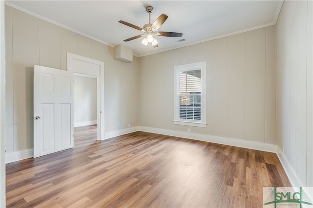 unfurnished room featuring crown molding, ceiling fan, and light hardwood / wood-style floors