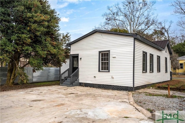 rear view of property featuring a patio