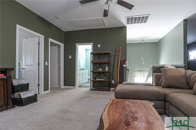 carpeted living room featuring ceiling fan