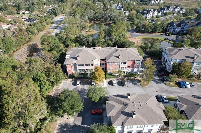 aerial view with a water view and a residential view