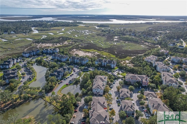 bird's eye view with a water view and a residential view