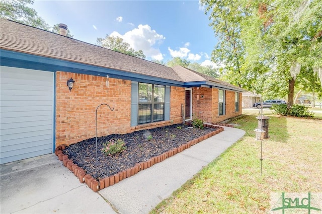 doorway to property with a lawn