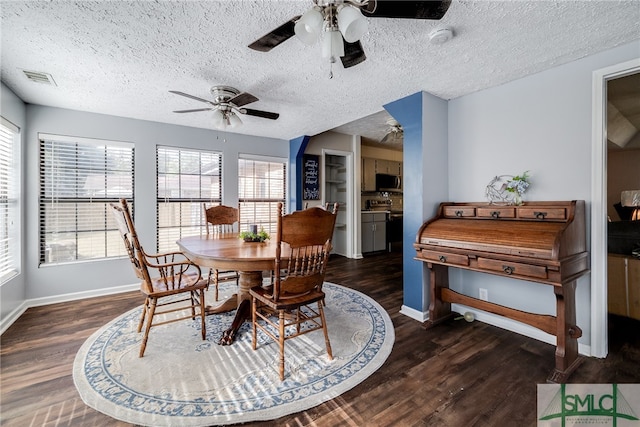 dining room with dark wood-type flooring, a textured ceiling, and ceiling fan