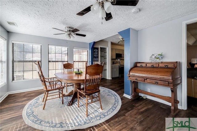 dining space with ceiling fan, a textured ceiling, and dark hardwood / wood-style flooring