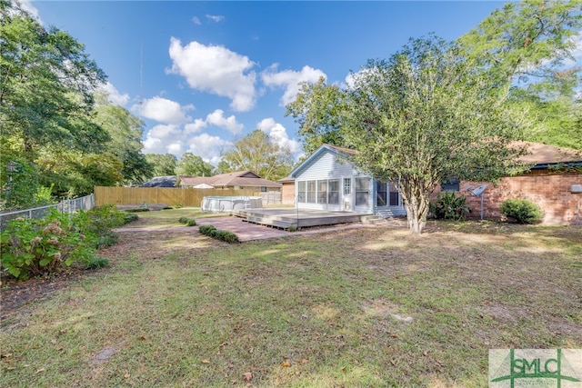 view of yard featuring a wooden deck