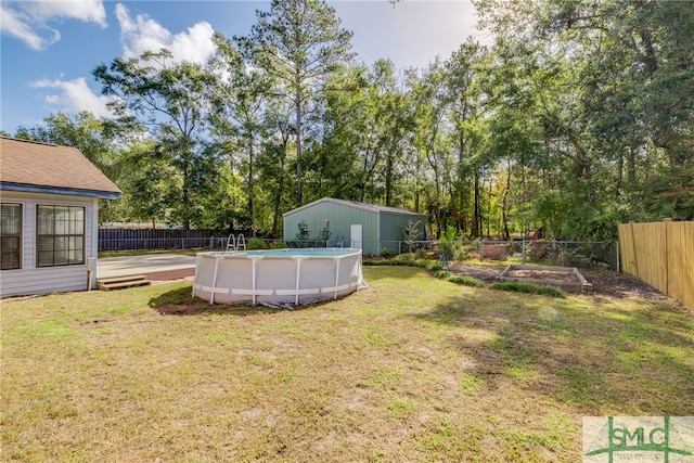 view of yard with a fenced in pool