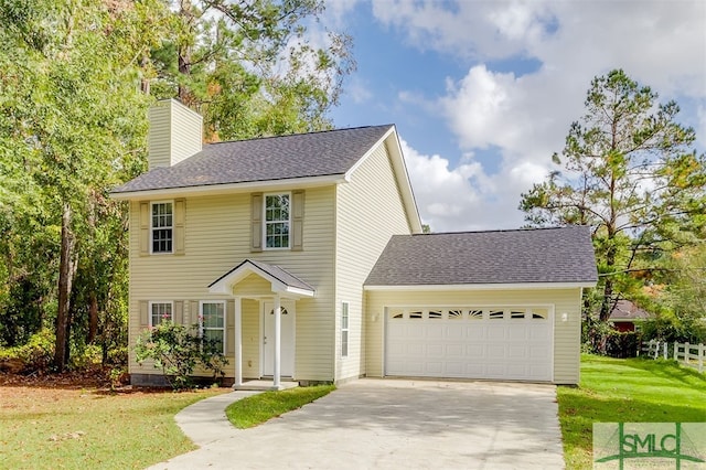 view of front facade featuring a front yard and a garage