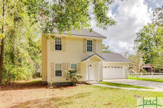 view of front facade with a garage and a front lawn