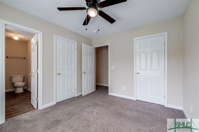 unfurnished bedroom featuring light carpet, a textured ceiling, connected bathroom, and ceiling fan