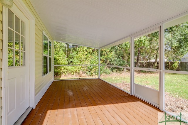 unfurnished sunroom with plenty of natural light