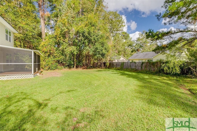 view of yard featuring a sunroom