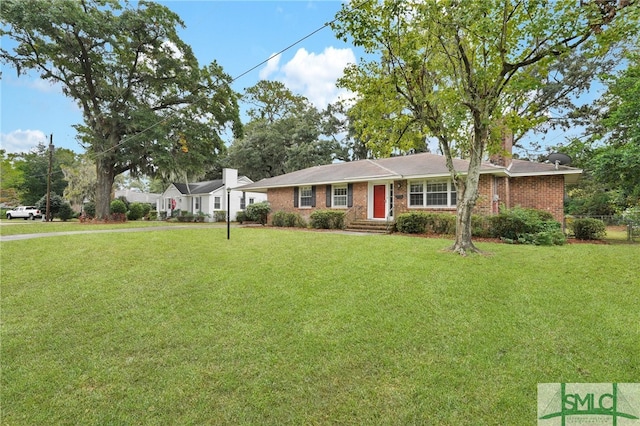 single story home featuring a front yard