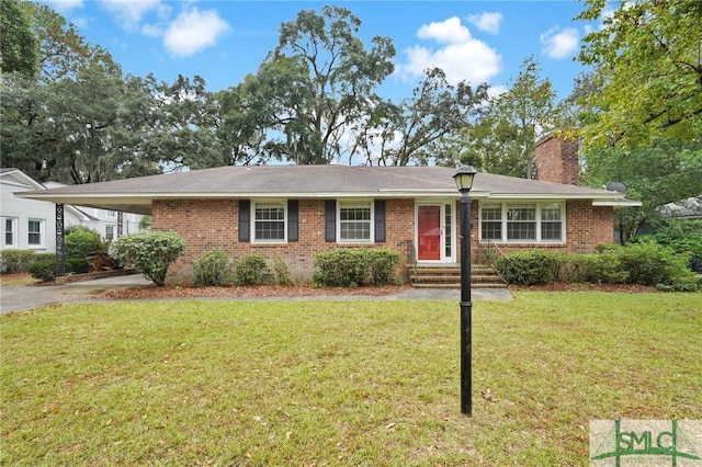 single story home with a carport and a front lawn