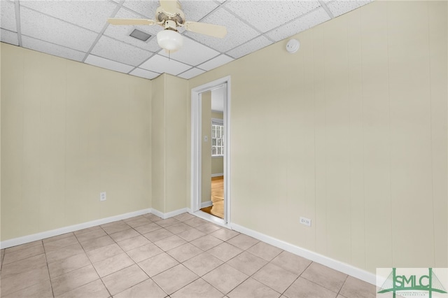 spare room featuring ceiling fan and light tile patterned floors