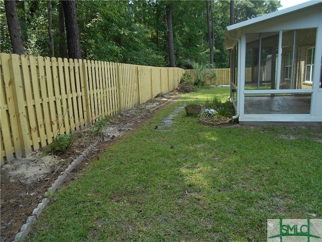 view of yard featuring a sunroom