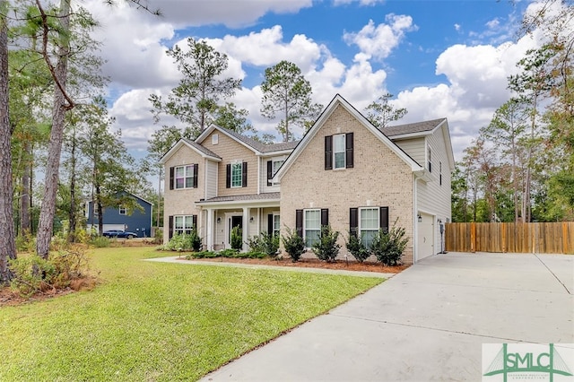 view of front of house with a garage and a front lawn