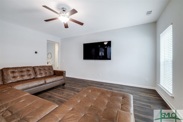 living room with ceiling fan, a healthy amount of sunlight, and dark hardwood / wood-style flooring