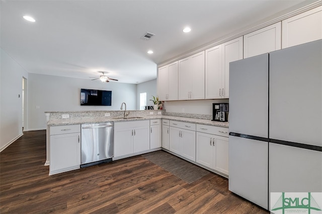 kitchen featuring kitchen peninsula, stainless steel dishwasher, white cabinets, white refrigerator, and dark hardwood / wood-style flooring