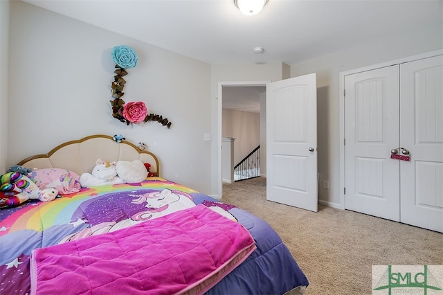 carpeted bedroom featuring a closet